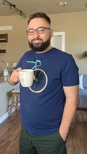 Sam Ismail, coffee in hand